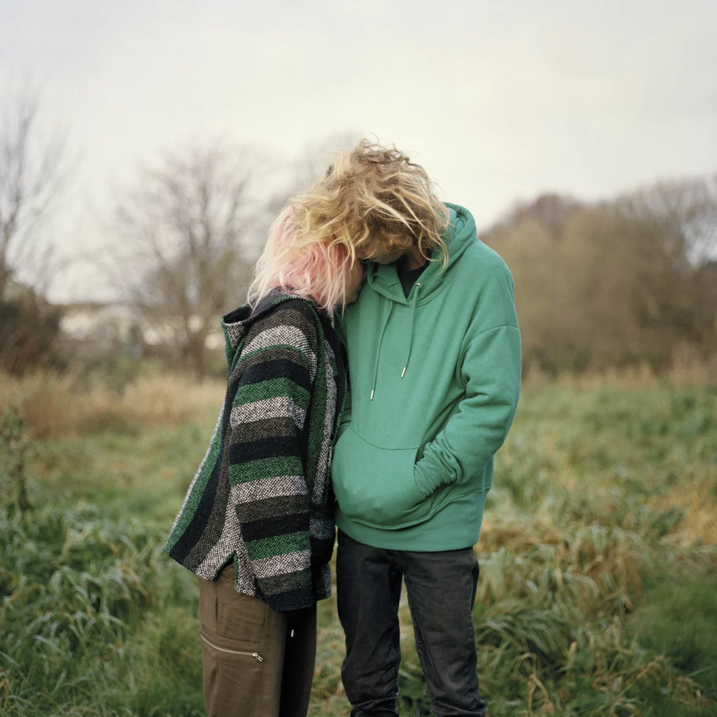 Rhiannon Adam. <em>Callum and Kai outside their tent at Maple Farm</em>, from <em>The Rift – Fracking in the UK</em> series, 2018. Courtesy of the artist and The British Journal of Photography, London.