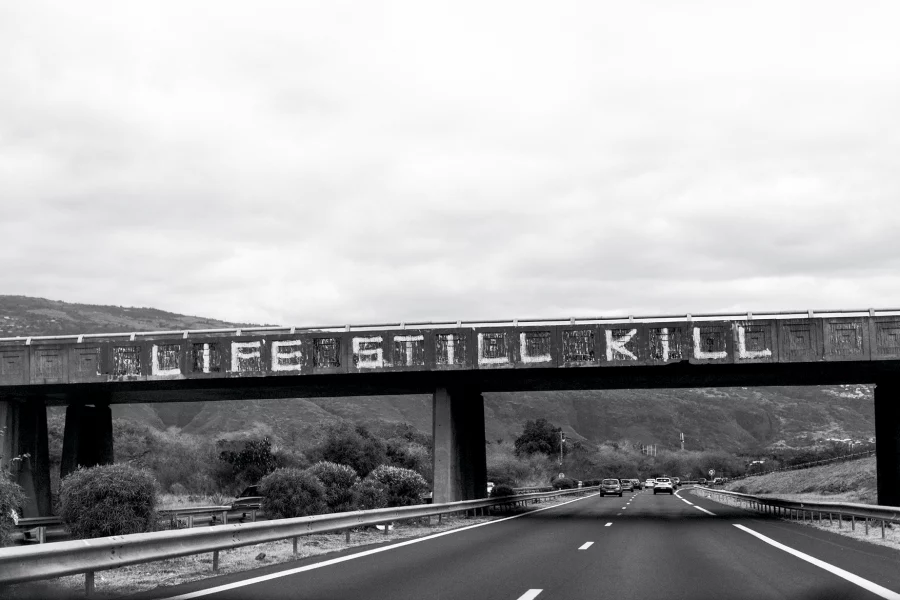 Laia Abril. Life Still Kill, Graffitti on the road between Le Port and St Paul, from Feminicides series, 2019. Courtesy of the artist.
